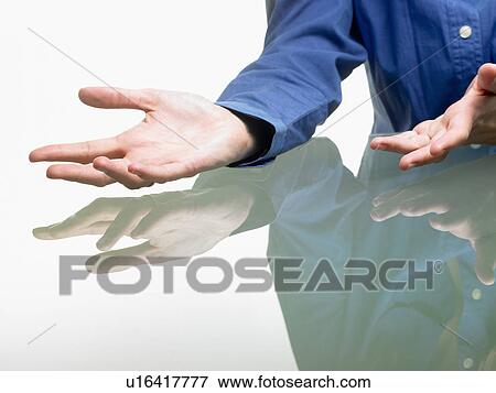 Stock Photo - Hands of a woman on table. Fotosearch