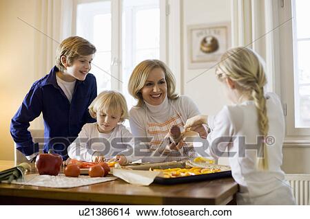 happy mother and children cooking View Large Photo Image Picture - happy mother and children cooking. Fotosearch