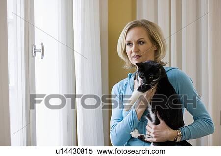happy woman holding cat View Large Photo Image Stock Photography - happy woman holding cat. Fotosearch