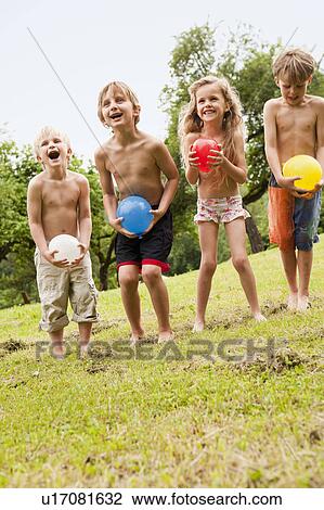 Kids Playing in Garden View Large Photo Image Stock Image - Kids Playing in Garden. Fotosearch