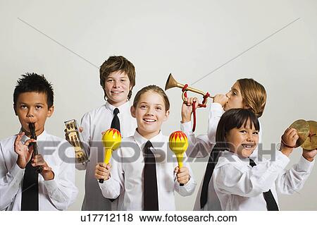 Stock Photo - kids playing musical instruments. Fotosearch