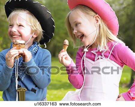 Kids with costume, eating ice-cream View Large Photo Image Stock Image - Kids with costume, eating ice-cream. Fotosearch