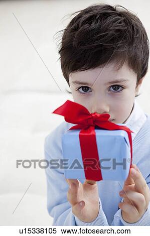 little boy with present View Large Photo Image Stock Photography - little boy with present. Fotosearch