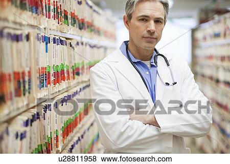 Male Doctor looking concerned View Large Photo Image Stock Photo - Male Doctor looking concerned. Fotosearch