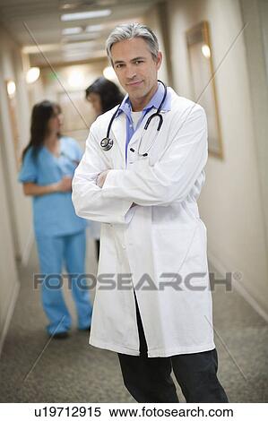 Male Doctor smiling View Large Photo Image Stock Photography - Male Doctor smiling. Fotosearch