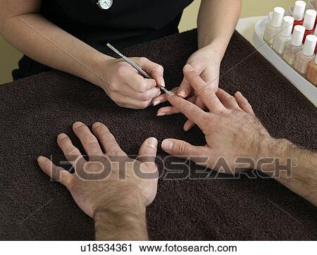 male hands receiving manicure View Large Photo Image Stock Image - male hands receiving manicure. Fotosearch