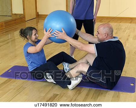 man and daughter exercise at gym View Large Photo Image Stock Image - man and daughter exercise at gym. Fotosearch