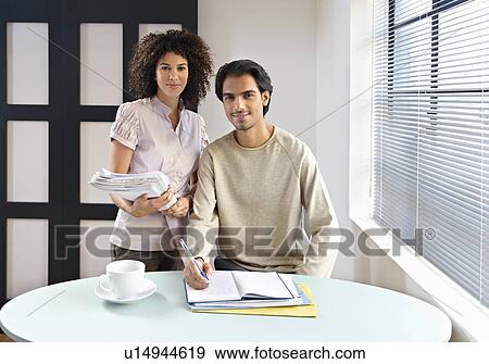 Man and woman in office cafe View Large Photo Image Stock Photo - Man and woman in office cafe. Fotosearch