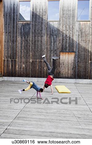 man and young girl playing in a court View Large Photo Image Stock Photograph - man and young girl playing in a court. Fotosearch
