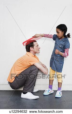 man being combed by young girl View Large Photo Image Stock Image - man being combed by young girl. Fotosearch