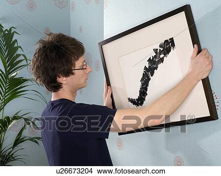Man carrying rolled rug View Large Photo Image Picture - Man carrying rolled rug. Fotosearch