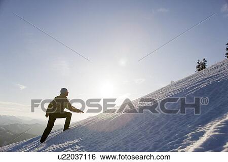 man climbing snowy mountain View Large Photo Image Stock Photograph - man climbing snowy mountain. Fotosearch