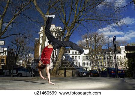 man doing back flip on street View Large Photo Image Stock Photo - man doing back flip on street. Fotosearch