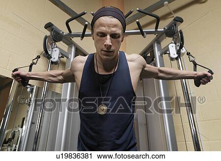 man exercising at gym View Large Photo Image Stock Image - man exercising at gym. Fotosearch