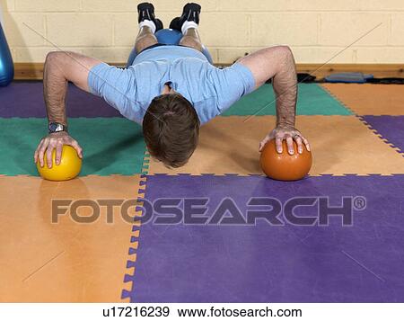 man exercising at gym View Large Photo Image Stock Photo - man exercising at gym. Fotosearch