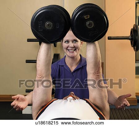 man exercising with weights at gym View Large Photo Image Stock Photography - man exercising with weights at gym. Fotosearch