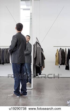man looking at himself in mirror View Large Photo Image Stock Photo - man looking at himself in mirror. Fotosearch