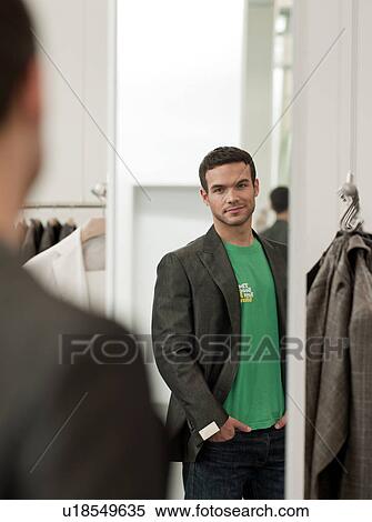man looking at himself in mirror View Large Photo Image Stock Photography - man looking at himself in mirror. Fotosearch