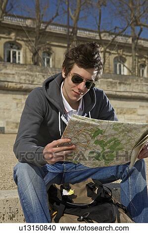Man looking on the map View Large Photo Image Stock Image - Man looking on the map. Fotosearch