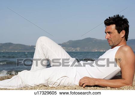 Man On Beach Enjoying Sun View Large Photo Image Stock Photography - Man On Beach Enjoying Sun. Fotosearch