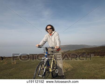 man on bike View Large Photo Image Stock Image - man on bike. Fotosearch