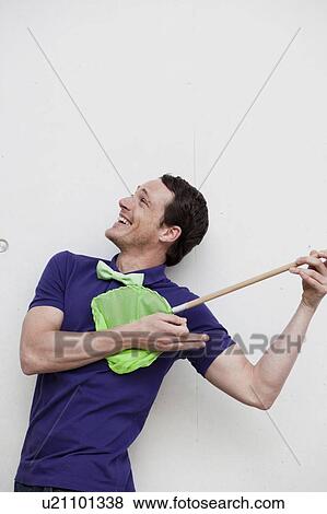 Stock Photo - man playing with butterfly net. Fotosearch