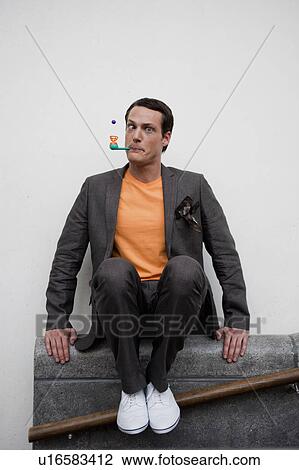 man playing with toy pipe View Large Photo Image Stock Image - man playing with toy pipe. Fotosearch