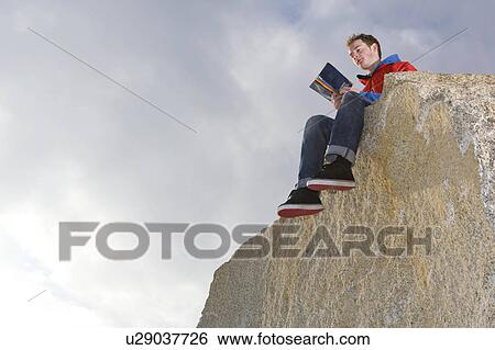 man reading on mountain top View Large Photo Image Stock Photograph - man reading on mountain top. Fotosearch