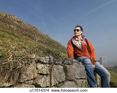 man resting on hike View Large Photo Image Picture - man resting on hike. Fotosearch