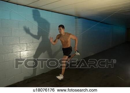 man running in tunnel View Large Photo Image Stock Photograph - man running in tunnel. Fotosearch