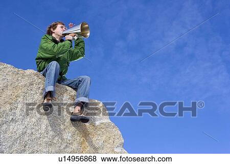 Man shouting through megaphone View Large Photo Image Stock Photo - Man shouting through megaphone. Fotosearch