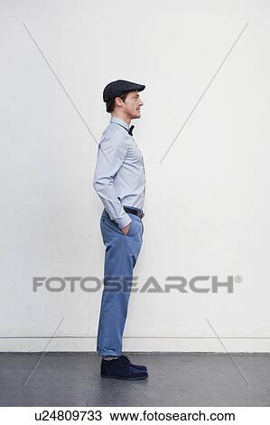Stock Image - man standing upright. Fotosearch