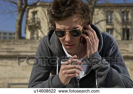 Man talking on cell phone View Large Photo Image Stock Image - Man talking on cell phone. Fotosearch