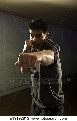 man throwing punch View Large Photo Image Stock Image - man throwing punch. Fotosearch