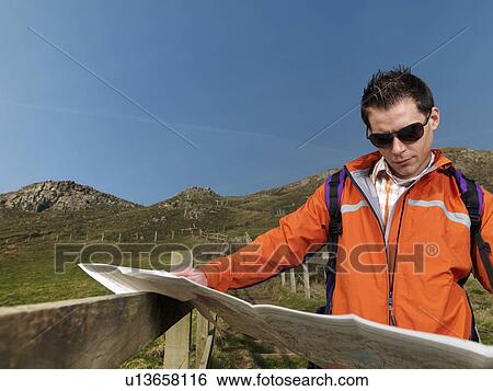 Stock Photograph - man with map. Fotosearch