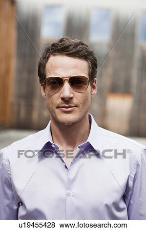 man with sunglasses looking at viewer View Large Photo Image Stock Photo - man with sunglasses looking at viewer. Fotosearch