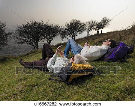 man & woman on phone during hike View Large Photo Image Stock Image - man & woman on phone during hike. Fotosearch