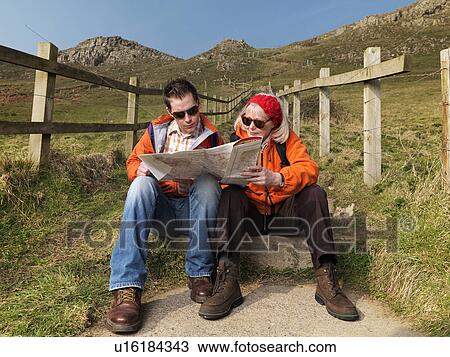 man & woman studying map View Large Photo Image Stock Image - man & woman studying map. Fotosearch
