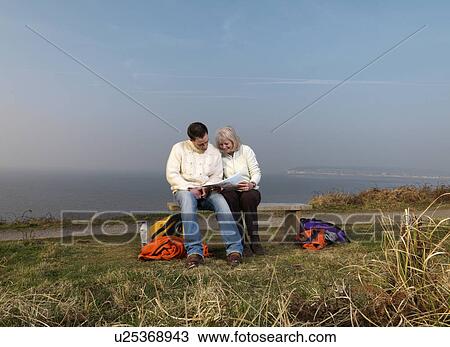man & woman studying map View Large Photo Image Stock Image - man & woman studying map. Fotosearch