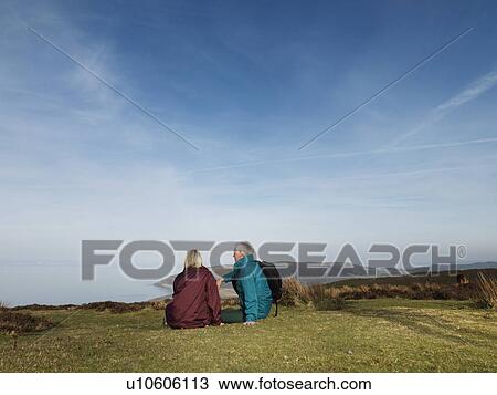 mature couple relaxing on moor View Large Photo Image Stock Image - mature couple relaxing on moor. Fotosearch