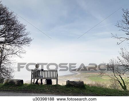mature woman enjoying coastal view View Large Photo Image Stock Photo - mature woman enjoying coastal view. Fotosearch