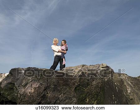 mature woman with child on rocks View Large Photo Image Stock Image - mature woman with child on rocks. Fotosearch