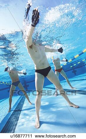 Men exercising in swimming pool. View Large Photo Image Stock Image - Men exercising in swimming pool.. Fotosearch