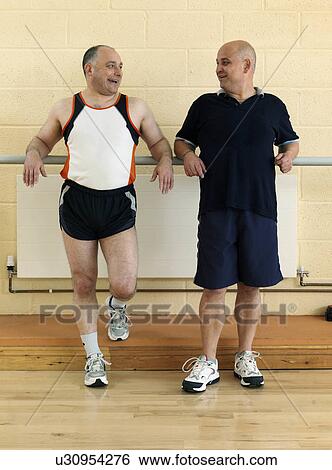 men relaxing at gym View Large Photo Image Stock Photograph - men relaxing at gym. Fotosearch