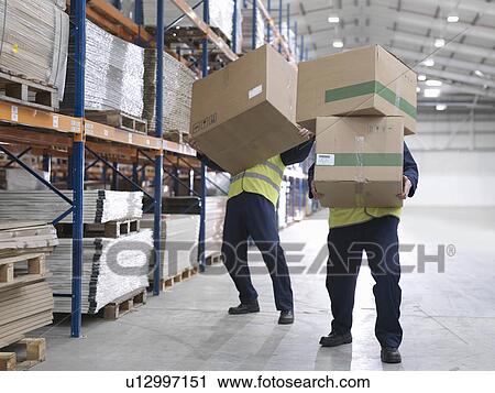 Men Struggling With Boxes In Warehouse View Large Photo Image Stock Image - Men Struggling With Boxes In Warehouse. Fotosearch