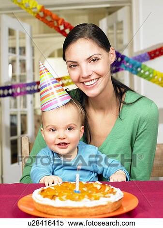 Stock Photography - Mother and baby boy, celebrating. Fotosearch
