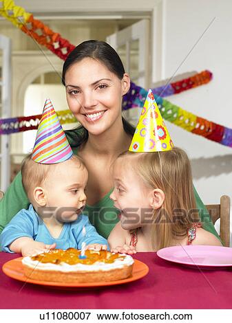 Stock Photo - Mother and children, celebrating. Fotosearch