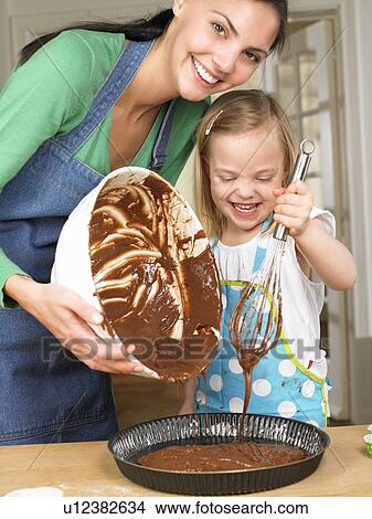Mother and daughter cooking View Large Photo Image Picture - Mother and daughter cooking. Fotosearch
