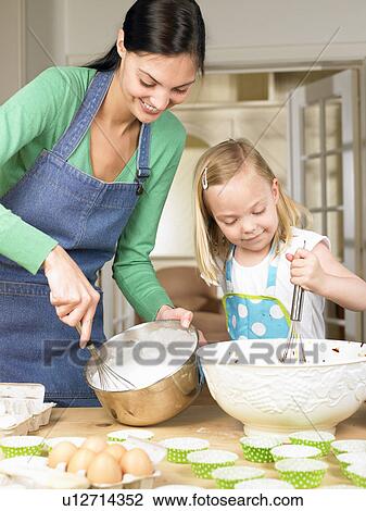 Mother and daughter cooking View Large Photo Image Stock Image - Mother and daughter cooking. Fotosearch
