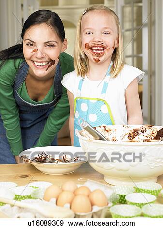 Mother and daughter cooking View Large Photo Image Stock Photo - Mother and daughter cooking. Fotosearch